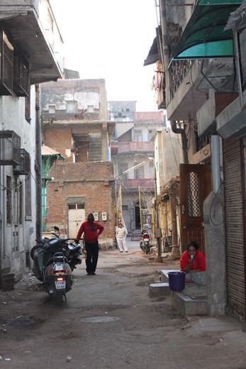 The laneways of the Old City in Ahmedabad hold many stories of both ancient and contemporary life. A 200 year old dwelling built up against a 400 year old building joined to 600 year old architecture provides a visual feast of texture and colour.  In contrast this family is amidst contemporary daily life oblivious to their everyday surroundings captivating my heart and how I will remember it forever and share it with the world through my lens.
