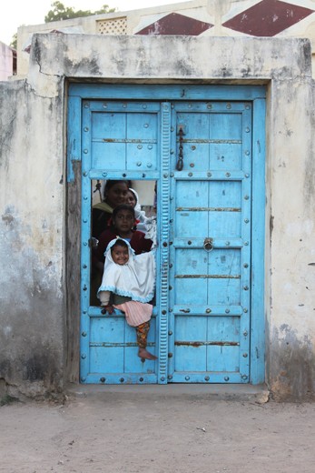 The contemporary life of this family in the Old City of Ahmedabad retains honour and privacy in often difficult conditions behind traditional customised architecture. This blue is connotative of Lord Krishna portraying subtle symbolism of religion and spirituality characteristic of the oldest surviving civilisation. The joy of the young girl and inquisitive nature of the women is a reflection of our attitude towards this image. 