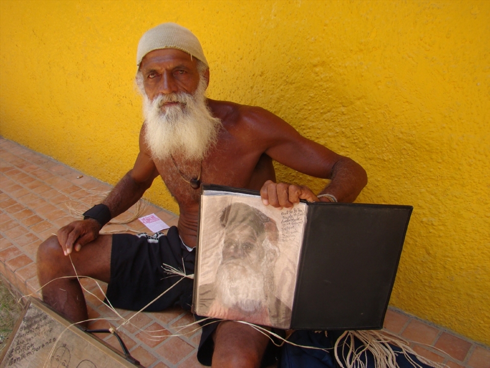 The Artist
This was in the centre of Morro de São Paulo. The man was sitting on pavement next to the wall and weaving bracelets. 
