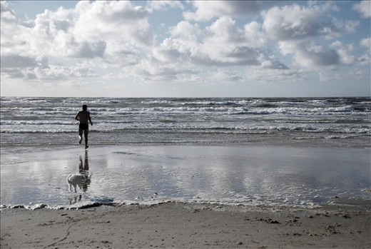 The ocean temperature rarely reach above 15 degrees Celsius during the summer, but that's nothing that prevent lively people from taking a trip to the beach at Jammerbugten in Northern Denmark. Excitement showing as the water gets barely warm enough to swim in, though still not warm enough for the accompanying loyal dog Lou that jumps in desperation to avoid the ice cold water.