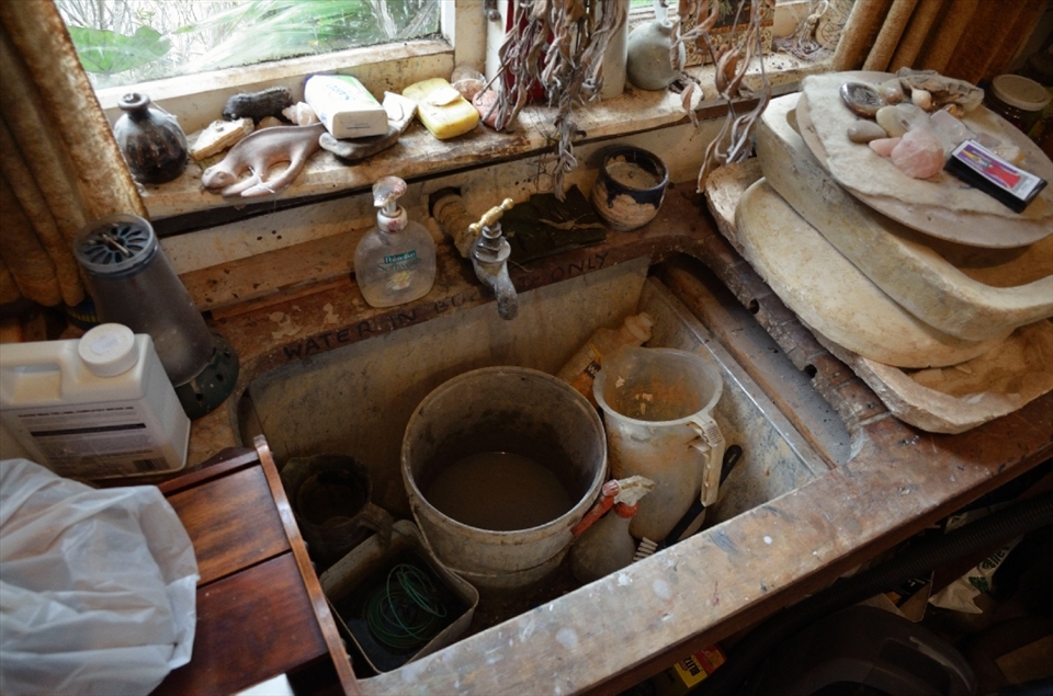 At first the studio appears to house a massive sink but the studio does not have plumbing. The bucket is emptied elsewhere.
