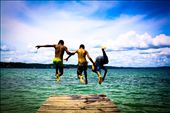 Leap of faith:
In between the moments of hardships to keep their families well-fed and cared for, people of Bolivia have learnt to derive pleasures from very small things in life. I saw Juan, Aleron and Cassius (L-R) playing around at the shore of Lake Titicaca. I asked these friendly kids to jump from the boardwalk while I capture their jump from behind and they enthusiastically agreed. I think this picture is an ultimate expression of human joy: the vibrant colors of the sky and the water are a perfect backdrop to the care-free attitude of the kids in spite of having just entered an intimidating world of adversities.
NB: For continuation of my story, please take this as photo # 5. (I could not change the order of the photos): by nitinb82, Views[423]