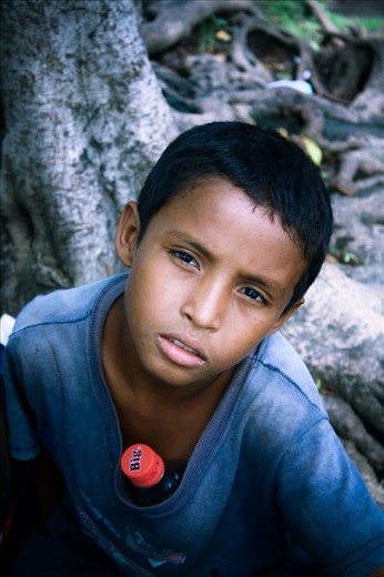 Street Urchin:
La Paz is crowded by kids soliciting for money. I saw him at a park. There was something about the expressions on his face that caught my attention: a cocktail of despair, anguish, helplessness and agony all throwing a thin curtain over leftovers of a lost smile. When I asked him why he doesn’t go to school, he said “what would I eat?” Before I could ask his name, he grabbed the coins from my hand and ran off to solicit another foreigner.
NB: For continuation of my story, please take this as photo # 2. (I could not change the order of the photos)