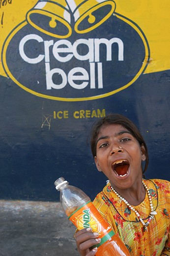 This girl is ecstatic after I bought her biscuits and a drink in Pushkar.