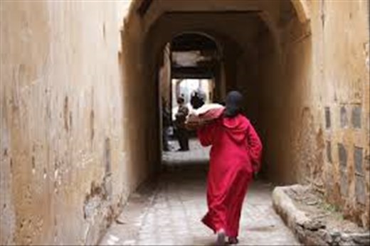 Woman Bringing Bread to Communal Oven