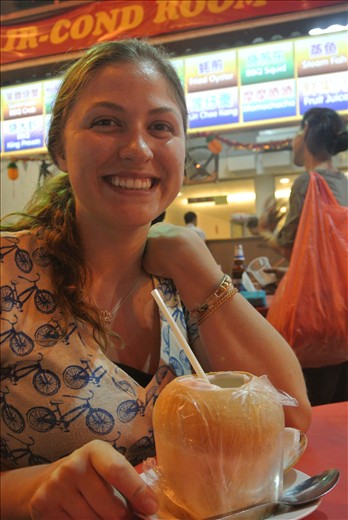 Drinking out of a coconut-KL