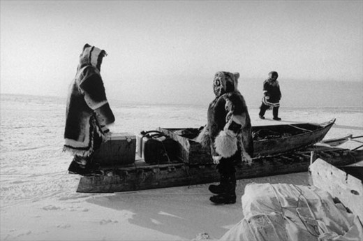 A sealing party pauses near the floe edge to do a recce.The kamatiq (traditional sled) is loaded with supplies that reflect a hybrid reality that blends the traditional with the modern. (temp: -40degCelsius)