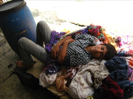 Nap time for hardworking boys. Erbil Souk. Iraq.