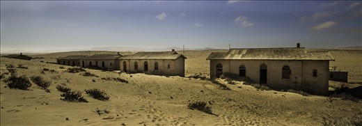 The  former Namibian diamond mining town of Kolmanskop being reclaimed by the desert