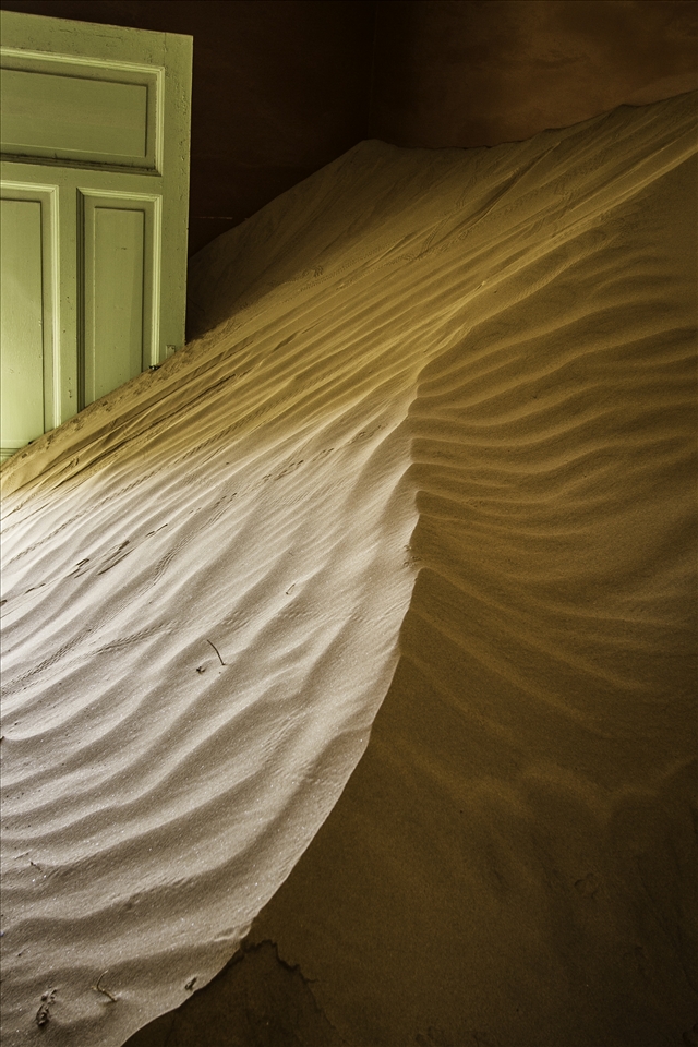 Dunes not only enter the houses, but nearly fill entire rooms