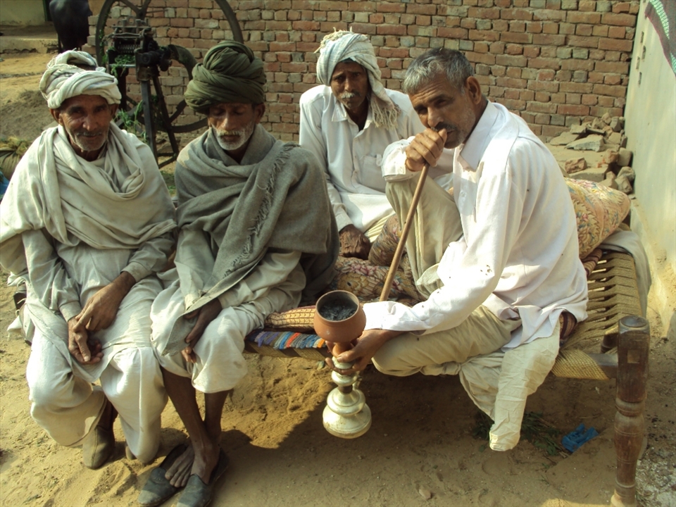 Chilling out in the afternoon - one of the leisure activities of the men living in the villages is gathering and smoking using a special tool (pipe) called chillum