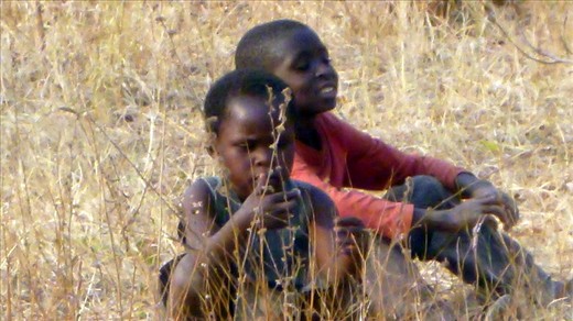 Orphans hanging out with us at the drilling site