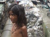 This child lives in a hut beside a mountain of putrid garbage and toxic water: by nonietuxen, Views[517]