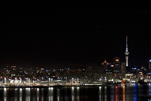 Auckland City in the early morning looking inland across the Waitemata harbour from Northead, Devonport.  One of New Zealands great icons, the Skytower clearly stands out against the early morning sky. Shot at F5.6, Shutter speed of 1sec, I.S.O 800 and Focal Length at 95mm