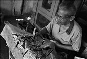 An old man demonstrates batik painting technique,this batik will be sold to the tourists who visit Taman Sari. Batik is Indonesia's traditional cloth, each batik has different meaning depends on its patterns.: by novandardwi, Views[499]