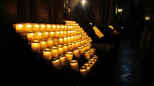 Candles lit on a Sunday in Notre Dame Cathedral.