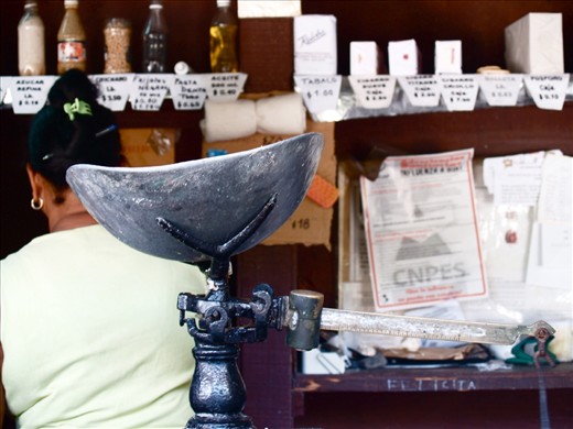 Food rationing in Cuba is known as Libreta de Abastecimiento, where the system establishes not only the amount of food but also the frequency a household is allowed to purchase the goods. Frankly, I took it because I liked the antique weighing scale. It was later on that I realized the story captured - together with the background of sugar, flour and the Cuban woman - which depicts the hardship the locals have to go through to get about with their daily lives.
