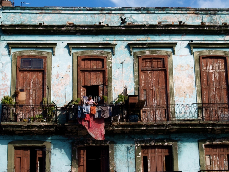 I am a big fan of antique buildings - especially when it comes to windows, balconies and doors. This is one of my lucky shots, as I managed to get the right composition and exposure within 5 seconds, before the light turned green! (I was on a double decker bus, going around La Havana)

La Havana consisted of buildings which is similar to the one depicted in this photograph. Despite the richness of  it's culture, Cuba still remains one of the countries with the highest poverty rate.