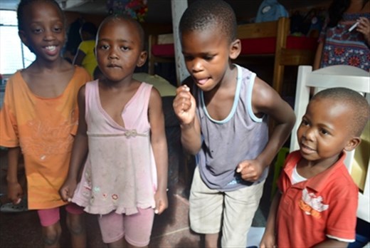 Although dont have reasons, children from townships smile and dance