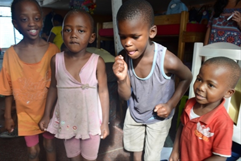 Although dont have reasons, children from townships smile and dance