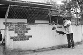 A man with little girl look at the crocodiles in the inside of crocodile cage in Asam Kumbang Crocodile Park.: by odell, Views[493]