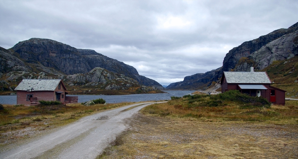 Fisherman's Huts on the side of a Fjord.