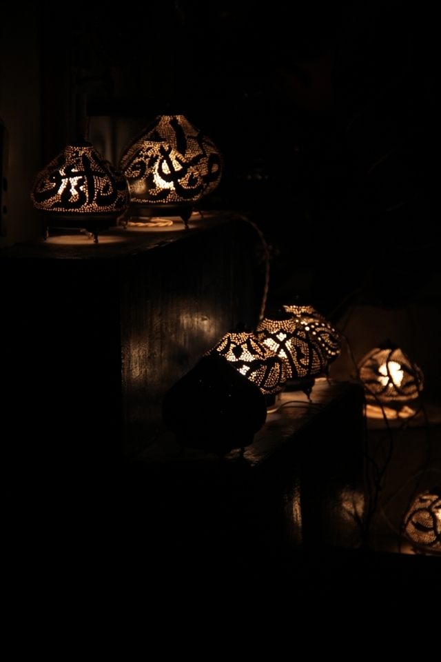 decorated light bulbs, traditionally made from cupper shaped as Arabic letters.