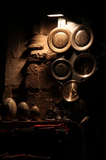 porcelain eggs and decorated scarfs and plates.