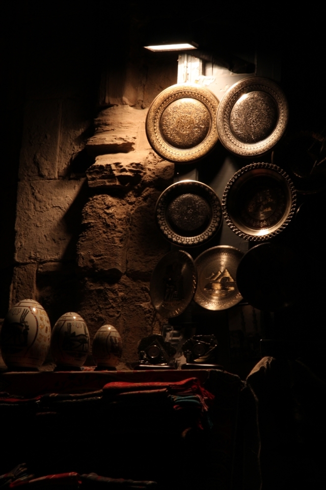 porcelain eggs and decorated scarfs and plates.