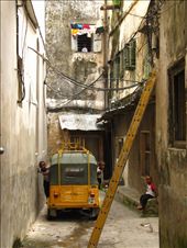 Getting lost in the architecture of Stonetown is impossible to avoid if you don't live there. Maps are useless in this maze of narrow stone alleys––down one lane might be a row of bustling craft shops, but make one turn and you may be alone. Here some children wait for random passerby to snicker and gawk at.: by olie, Views[397]