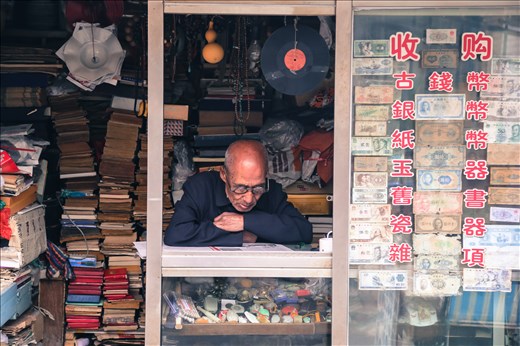 A man sitting reading in his stall full of old memorabilia in one of Tianjin’s few remaining houtongs (traditional alleyways). As a result of the cultural revolution in china a lot of ancient artefacts were lost. China has five hundred years of history and cultural wisdom to share with the world but the state of revolution the country faced has discouraged people from looking into its past. Will elements of Chinese culture and history remain hidden on dusty shelves whilst everyone is busy looking towards the future? 