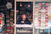 A man sitting reading in his stall full of old memorabilia in one of Tianjin’s few remaining houtongs (traditional alleyways). As a result of the cultural revolution in china a lot of ancient artefacts were lost. China has five hundred years of history and cultural wisdom to share with the world but the state of revolution the country faced has discouraged people from looking into its past. Will elements of Chinese culture and history remain hidden on dusty shelves whilst everyone is busy looking towards the future? : by olli_stewart, Views[412]
