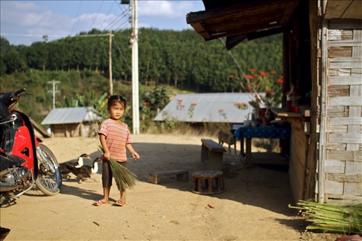 Girl welcoming us to her village in the foothills of Laos.