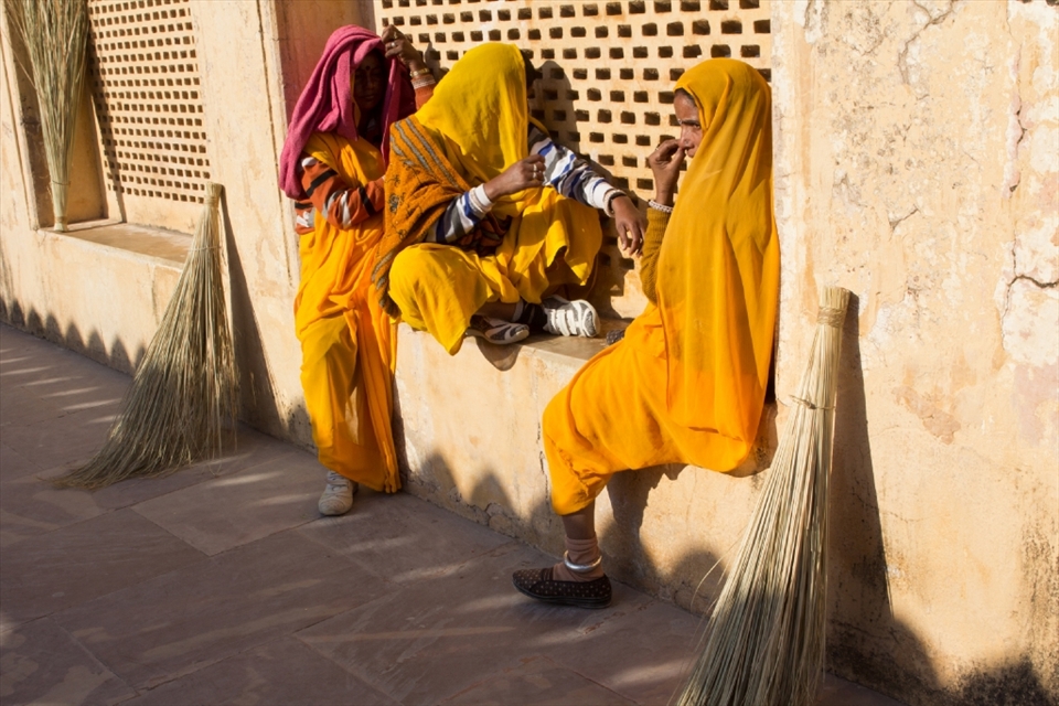 Women taking a break from thoroughly sweeping the interior of the Amer Palace in Jaipur.