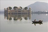 A man floats by the Jal Mahal Palace in Jaipur, removing trash from the site.: by olya, Views[527]