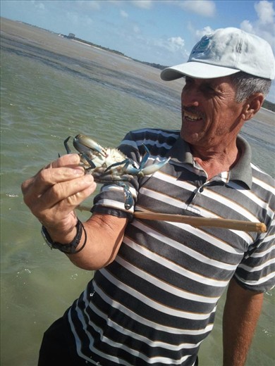 A very friendly fisherman showing his silent, lonely but joyful daily work catching crabs in Recife-Brasil.