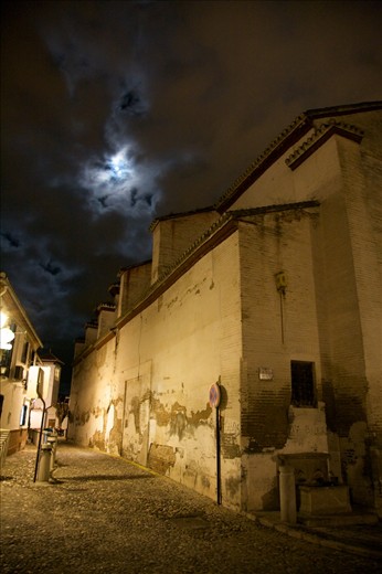 Watching the moon peek through the clouds over El Albaicin in Granada.