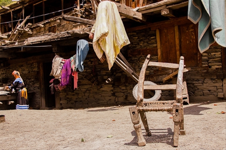 To erect homes along the slanted valley walls, Kalash houses are laid out such that the rooftop of a house is used as foundation for another house built above.  Having settled for generations on fertile river banks dotted by apricot and mulberry trees deep in the Hindukush, the Kalasha people live in tune with nature and take its provisions as blessings for their survival.