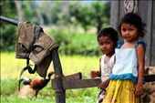 'home' - taken in the rural town of Kampot, South Cambodia. I was once again on my bike, cycling through the rice fields and noticed a brother and sister playing in front of their home. The moment captures their curiosity in me as much as them, in the setting of a normal day at home.: by oneglassglobe, Views[899]