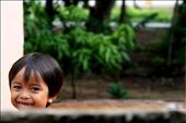 'pure smile' - taken in the rural town of Kampot, South Cambodia. A moment captured in the front yard of my home at the time. A curious, cheeky little boy peeking over the fence with an ear to ear smile. : by oneglassglobe, Views[695]