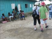 Group of tourists passing by inhabitants of the batey. 
The inhabitants of the host country were gathered outside sharing a moment together. I remember feeling like an unwanted guest, a creature part of a herd of loud animals with hoofs so big they could destroy everything they stepped on, a group of unjustly privileged human species confronted to a similar reality they face back home: homelessness. This moment seemed to summarize all I had ever learned on inequality, except this time it had a face.  : by onethousandwords, Views[542]