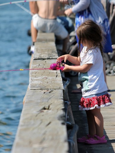 The trainee fisherm(wo)man by the water