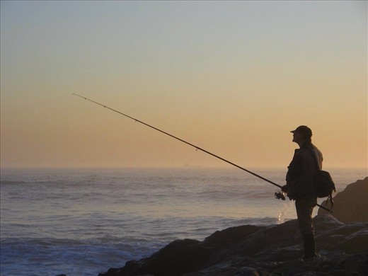 The focused fisherman by the water
