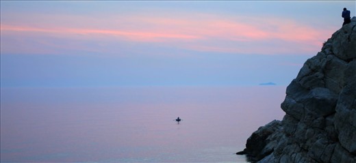 The isolated fisherman on the water