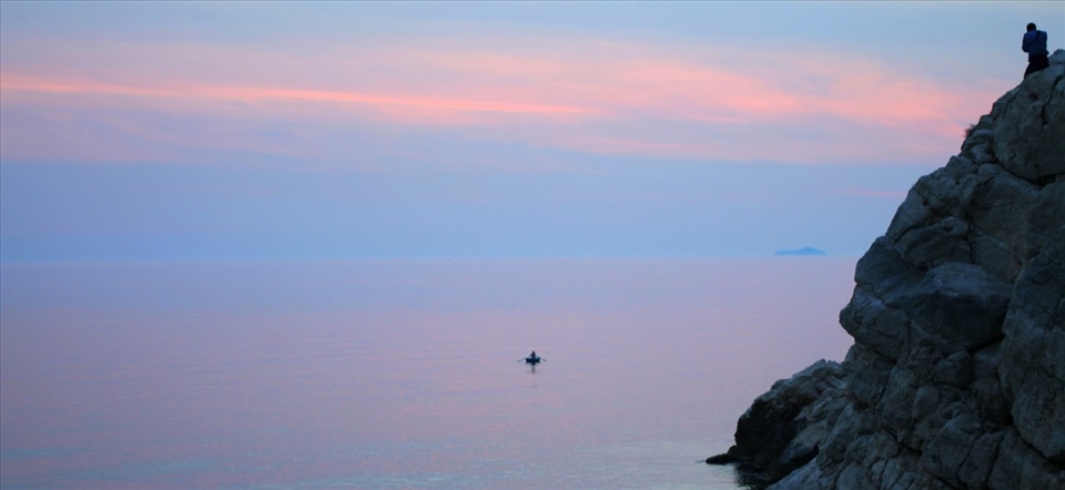 The isolated fisherman on the water