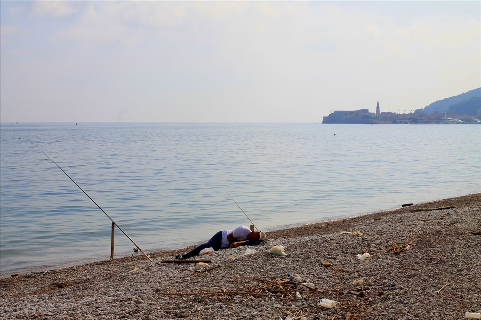 The lazy fisherman by the water