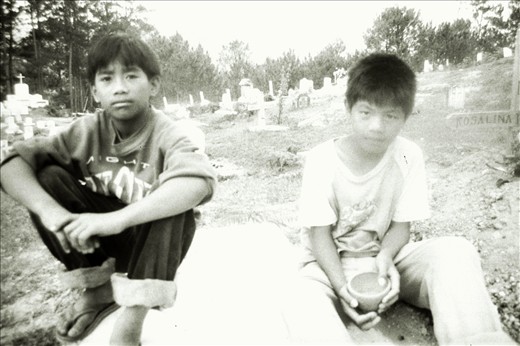 Two local kids take me to a cemetery on a hill in Sagada, North Philippines. 