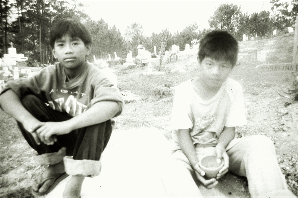 Two local kids take me to a cemetery on a hill in Sagada, North Philippines. 