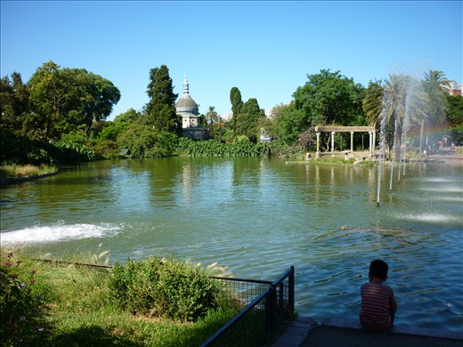Entrance of the zoo (Buenos Aires) with a bolivian child sitting on the right.