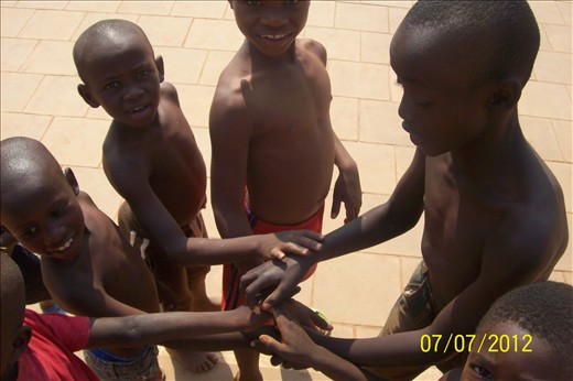kids planning the teamwork in soccer match warming up as barcelona